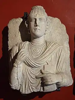 Bust from the 3rd century AD showing a fashionable woman holding a writing tablet in her hand. Rome, Italy