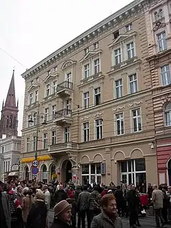 Main facade with St Peter's and St Paul's Church in Bydgoszcz in background