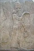 Relief with a winged genie with bucket and cone; 713-706 BC; height: 3.3 m