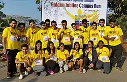 Students posing with medals after the Golden Jubilee Run