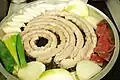 Uncooked gopchang prepared to cook on grill