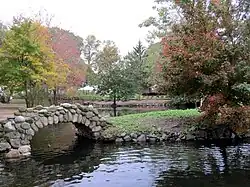 Stone bridge for one of the islands in the pond.