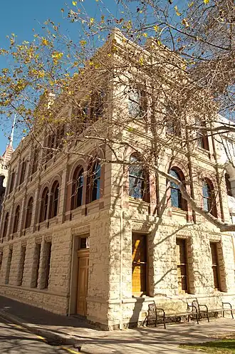 This is a photograph of the Howard Smith Building, built in 1900, which is one of many colonial-era maritime buildings.