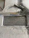Inscription on right side of wall