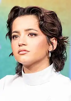 Isabela Merced looking to the left