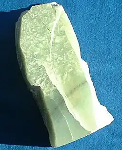 An irregular chunk of celedon green jade.