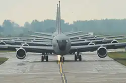 The front of several gray aircraft are centered in the image.