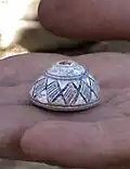 Miniature pottery vase with geometric pattern