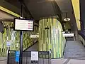 The stairs, PIDS and the green tile work at the concourse, June 2024