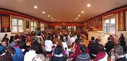 Khenpo Karthar resting in state in the main shrine room at Karme Ling