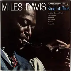 A closeup of Davis in profile while playing trumpet