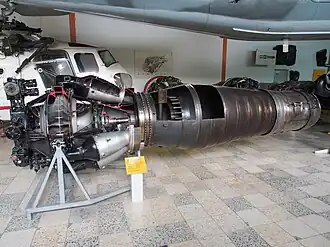 Klimov VK-1F turbojet with afterburner. An afterburner is a propulsive duct in which high velocity exhaust from an engine turbine is converted into pressure in a diffuser. Afterburner fuel is burned with the oxygen in the dilution air which was not involved in the engine combustion process. The gas expands in a nozzle with an increase in velocity. The turbojet afterburner has the same three requirements as a ramjet, both being propulsive ducts. These are conversion of high velocity gas into pressure in a diffuser, combustion and expansion to a higher velocity in a nozzle. The turbojet/afterburner combination was sometimes considered in the late 1940s a turbo-ramjet.[34][35]