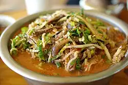 Jari mulhoe, mulhoe (sliced raw fish with a mixture of water and spice sauce), made with damselfish (Chromis notata).