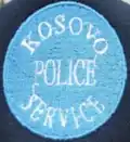 First cap badge of the Kosovo Police Service[21]