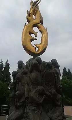 a memorial with sculpture of children and parents