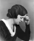 A photograph of Latife Hanım writing to Ms. Mevhibe İnönü: "With affection to my dear sister Mevhibe İsmet".