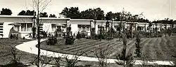 A black-and-white photo of some small tract houses