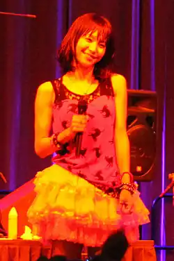 A woman in a red dress on a stage