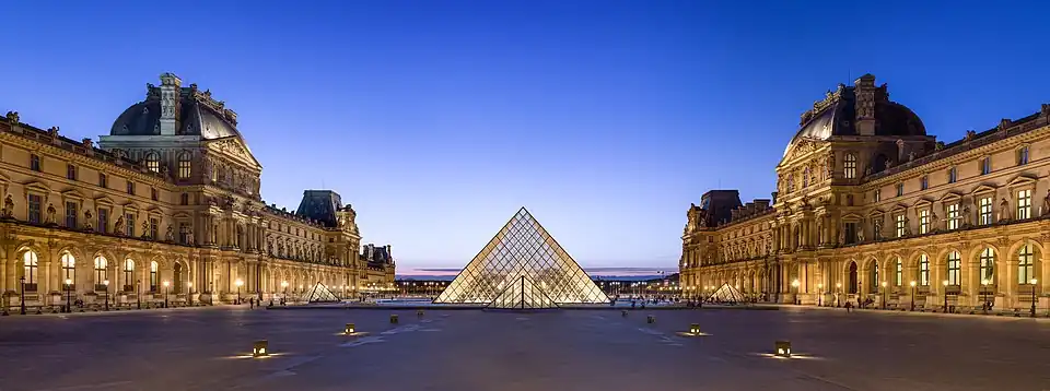 The Napoleon Courtyard and Ieoh Ming Pei's pyramid in its center, at dusk.