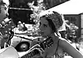 Singer Maria Muldaur in 1968, wearing a gypsy-style kerchief and hoop earrings
