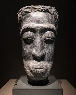 Marble sculpture of head.