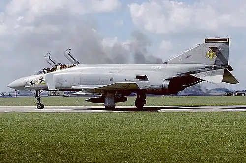 FG.1: 40&nbsp;in (100&nbsp;cm) telescopic nosewheel oleo; nose radome hinged to swing back; wider and shorter engine exhausts; bigger air intakes; deeper rear fuselage; RWR installation on tail-fin