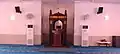 The minbar of the mosque, which is made out of wood with gold carvings.