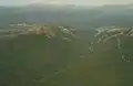 Mount Huxley from the air, at left, King River Gorge centre, Mount Jukes Highway to right, and Lake Burbury and the Crotty Dam at rear.