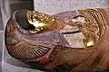 Mummy mask and coffin of one of Aline's daughters