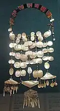 A necklace made of brass, mother-of-pearl and beads