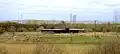 Visitor centre and picnic and play area seen from hill