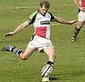 Nick Evans, All Black was a member of New Zealand's Under 20s, says Aussie Rules improved his kicking[32]