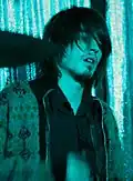 Colour photograph of Nick Jago performing live in 2006