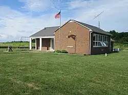 North Bass Island School, a one-room school with teacherage on Isle St. George of the Lake Erie Bass Islands was the last operating one-room school in Ohio. It ceased operations in 2005, and is maintained as an island heritage center.[22] K-8 students attended the school and flew to another island or the mainland for high school.