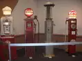 Four old-fashioned gasoline pumps at the 2012 Greater Milwaukee Auto Show.
