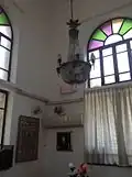 The synagogue interior with stained glass window