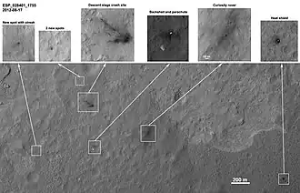 MSL debris field viewed by HiRISE on August 17, 2012 - parachute is 615&nbsp;m (2,018&nbsp;ft) from Curiosity.[60] (3-D: rover & parachute)