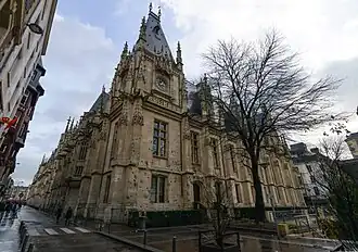 Facade with clock tower, built in neo-Gothic style (1885).
