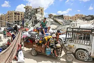 People evacuating from Hamad in August 2024