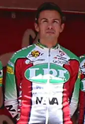 A cyclist dressed in a uniform.