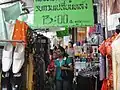 Atmosphere of clothing and textile stalls on Phahurat