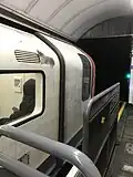 A London Underground 2009 Stock with phallic graffiti on its cab stands at Oxford Circus, 2025