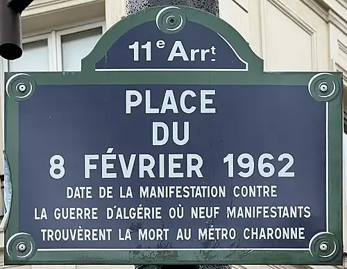 Street sign unveiled at the dedication of the square