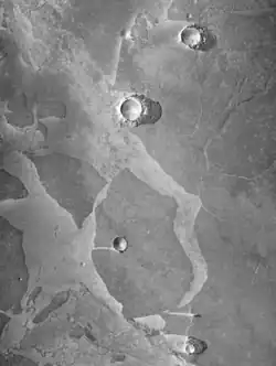 These icy plates moved to the left, and obstacles (crater rims) turned them into piles of pieces.