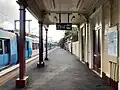 Northbound view from the station platform, with an X'Trapolis train idle at the station platform, May 2023
