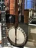 Rim of layered German silver and wood. Wood here is inlaid. Presentation banjos were meant to be fine works of art.