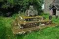 The base of an old cross on a square base with three steps covered in lichen