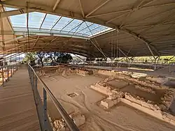 Photograph of Mycenaean ruins, showing the foundations of a wall