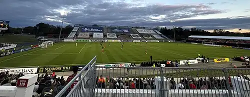 View of a football field with a large stand visible