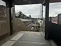 Stairs leading to Platform 1 from the western end of the concourse, October 2024